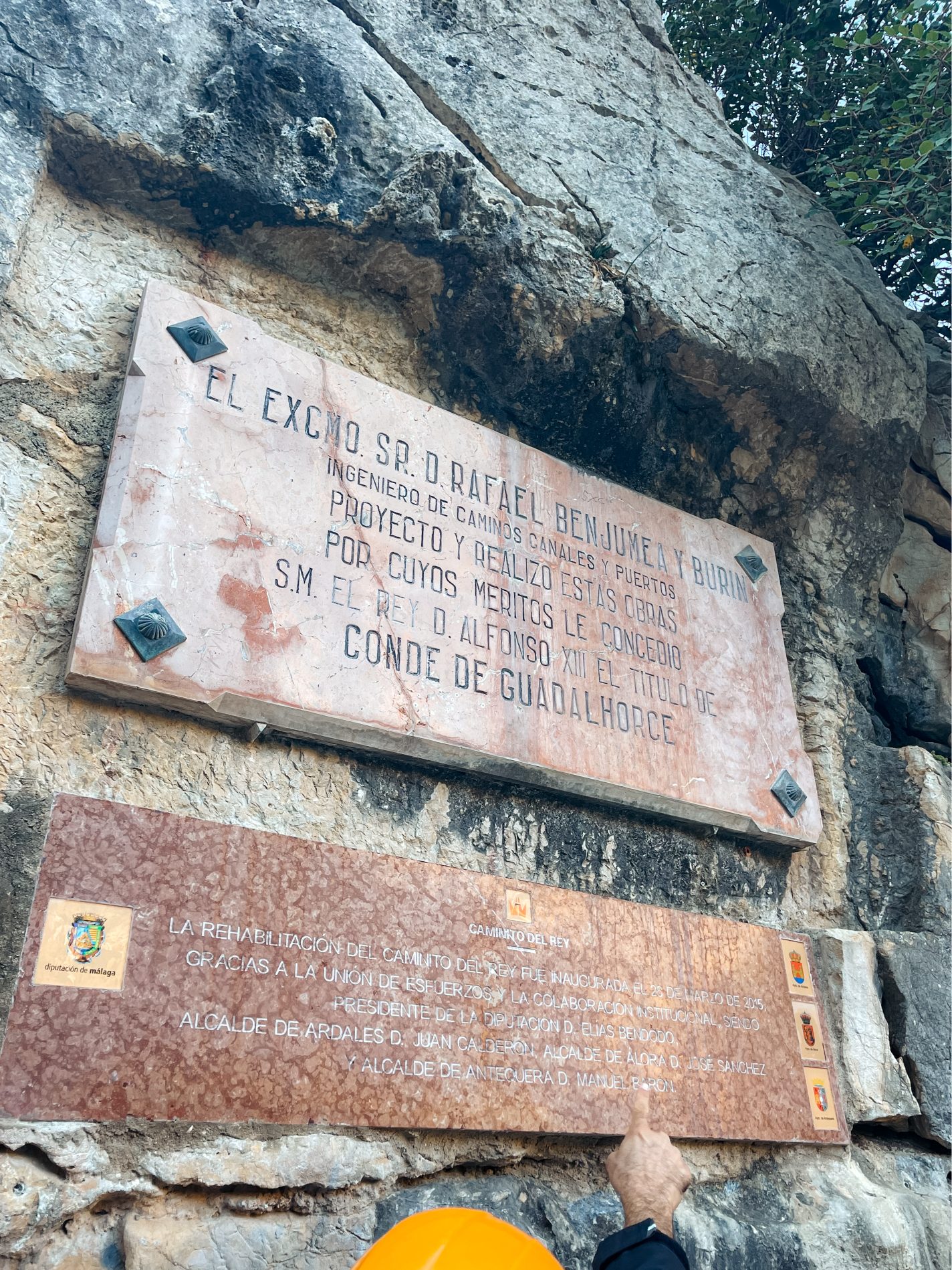 Commemorative plaques about the history right at the beginning of trail at el caminito del rey in malaga, spain