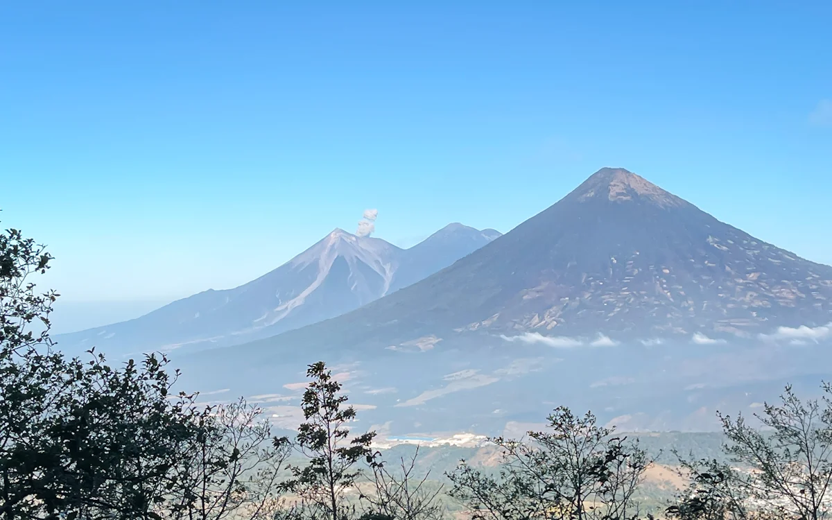 the view of volcan fuego from a distance while hiking in Guatemala road trip volcan fuego from a distance in Guatemala road trip